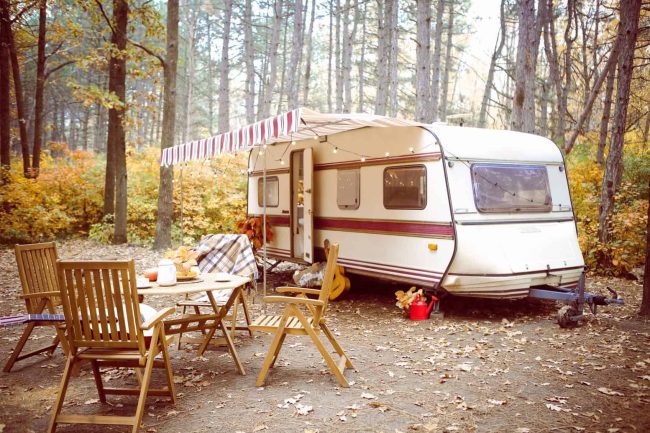 table-and-chairs-outside-trailer-in-nature-table-chair-caravan-countryside-autumn-teapot-teacup-leaf_t20_VWrZ21 Why Seasonal RV Camping Might Be For You