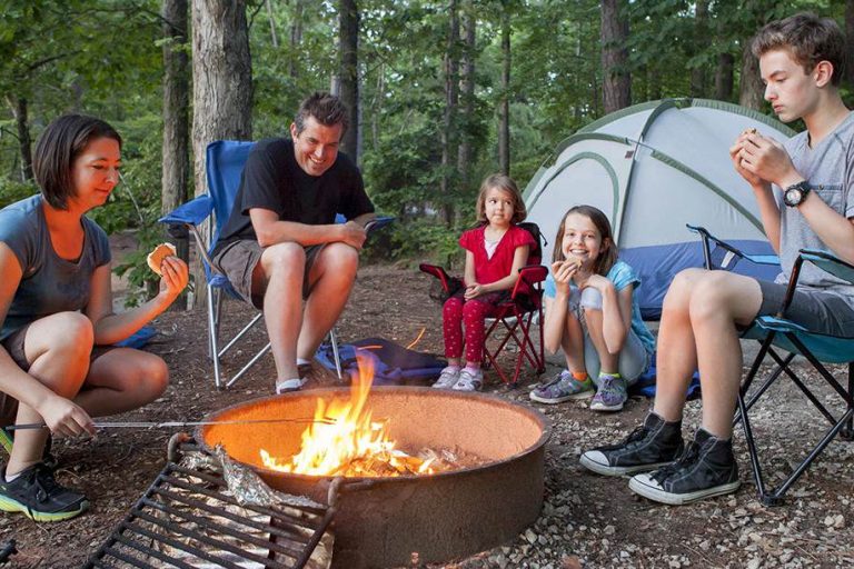family enjoying summer camping